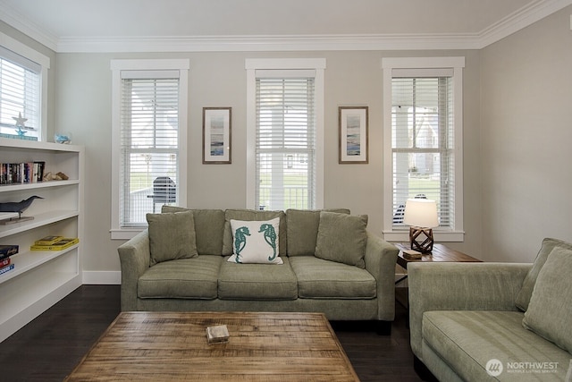 100 Horseshoe Ln, Pacific Beach, WA 98571 - living room featuring dark wood-style floors, crown molding, and healthy amount of natural light