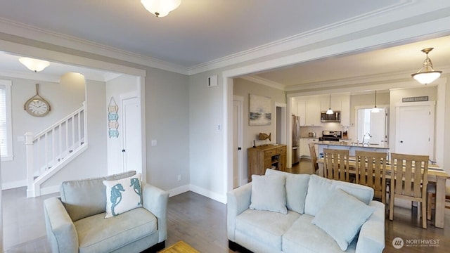 100 Horseshoe Ln, Pacific Beach, WA 98571 - living area featuring stairs, dark wood-style flooring, and crown molding