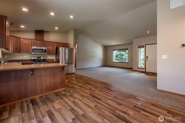 2124 Citation Loop, Wenatchee, WA 98801 - kitchen featuring stainless steel appliances, a peninsula, open floor plan, dark wood finished floors, and recessed lighting