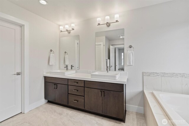 26637 NE Boyd Way Unit 102, Duvall, WA 98019 - bathroom with double vanity, a bath, and tile patterned floors