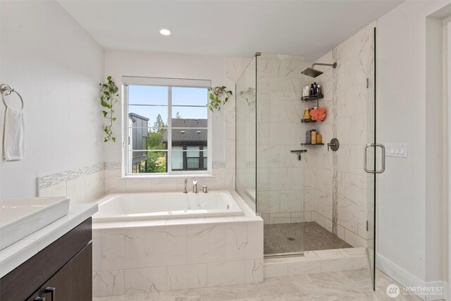 26637 NE Boyd Way Unit 102, Duvall, WA 98019 - bathroom with a garden tub, a shower stall, vanity, marble look tile flooring, and recessed lighting