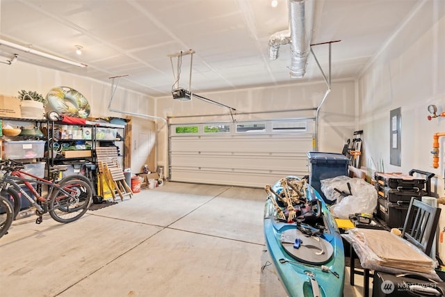 26637 NE Boyd Way Unit 102, Duvall, WA 98019 - garage featuring electric panel and a garage door opener