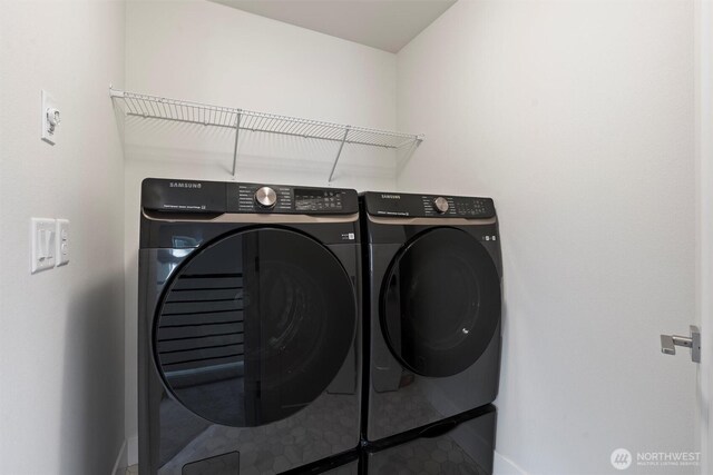 26637 NE Boyd Way Unit 102, Duvall, WA 98019 - washroom featuring washer and clothes dryer and baseboards