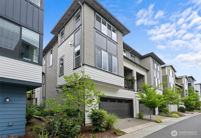 26637 NE Boyd Way Unit 102, Duvall, WA 98019 - view of property with an attached garage, asphalt driveway, and a residential view