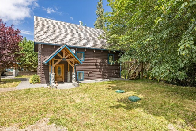 71 Waggler Way, Sequim, WA 98382 - rustic home with a front lawn