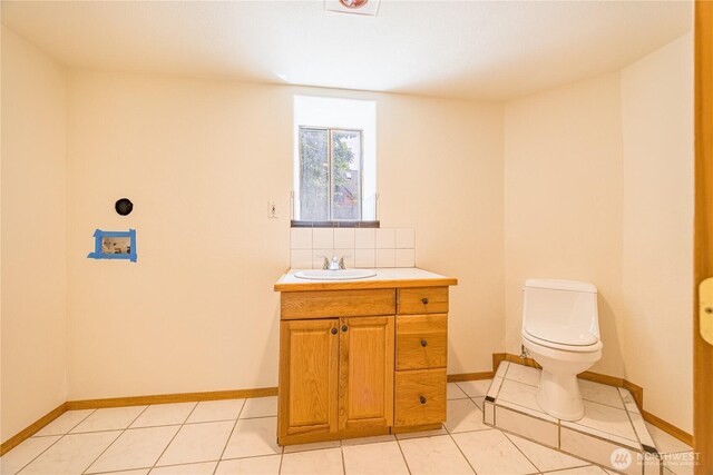 71 Waggler Way, Sequim, WA 98382 - half bath with vanity, decorative backsplash, and tile patterned flooring