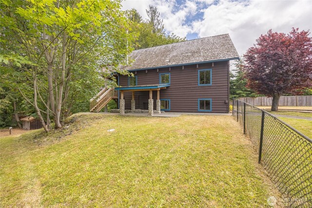 71 Waggler Way, Sequim, WA 98382 - rear view of property with stairway and a patio area