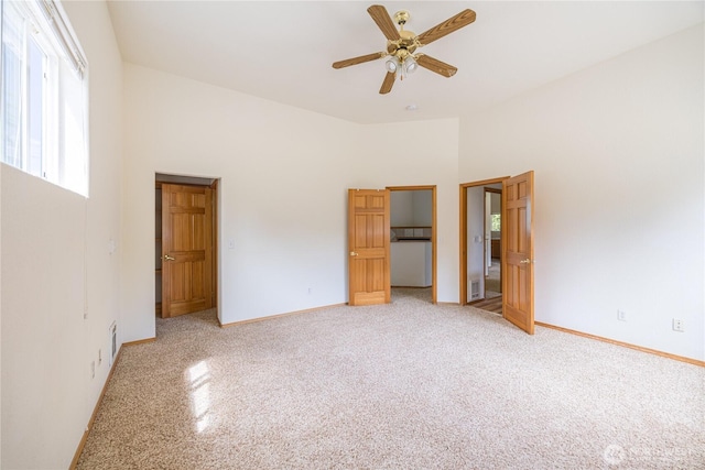 71 Waggler Way, Sequim, WA 98382 - unfurnished bedroom with multiple windows, a high ceiling, ceiling fan, a closet, and light colored carpet
