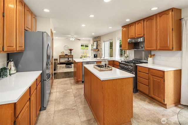 12820 SE 243rd St, Kent, WA 98030 - kitchen featuring appliances with stainless steel finishes, recessed lighting, a peninsula, a ceiling fan, and a center island