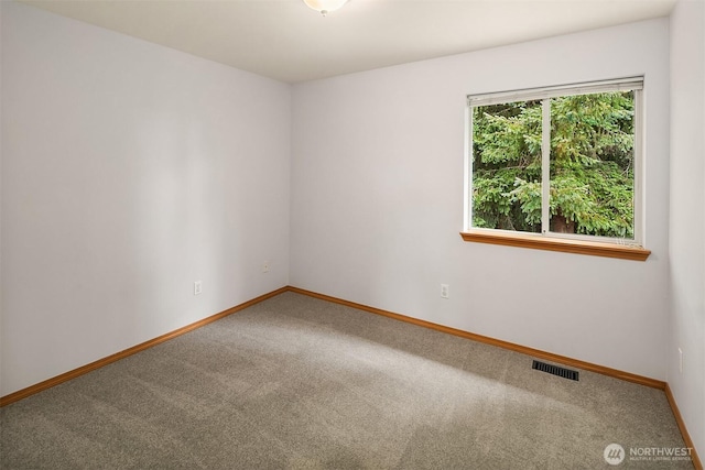 12820 SE 243rd St, Kent, WA 98030 - carpeted spare room with baseboards