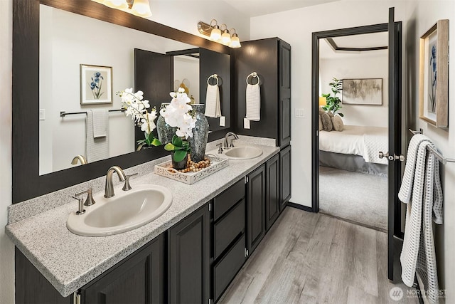 12820 SE 243rd St, Kent, WA 98030 - ensuite bathroom with wood finished floors and double vanity