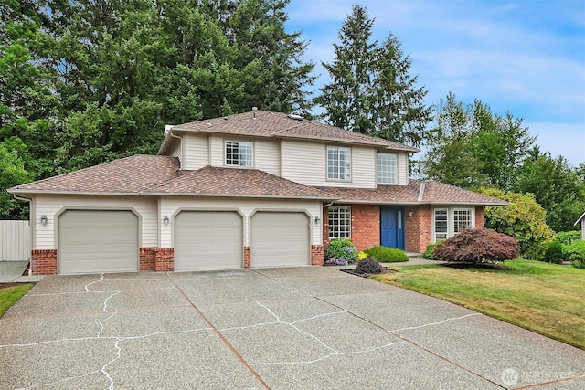 12820 SE 243rd St, Kent, WA 98030 - traditional home with brick siding, a garage, driveway, a front lawn, and a shingled roof