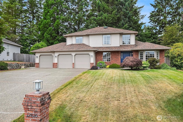 12820 SE 243rd St, Kent, WA 98030 - traditional home with a garage, driveway, brick siding, and roof with shingles