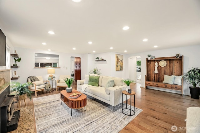 1339 N 167th St, Shoreline, WA 98133 - living area featuring arched walkways, recessed lighting, and wood finished floors