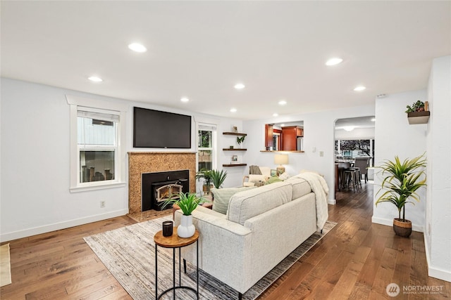 1339 N 167th St, Shoreline, WA 98133 - living area featuring dark wood finished floors, a fireplace with flush hearth, and recessed lighting