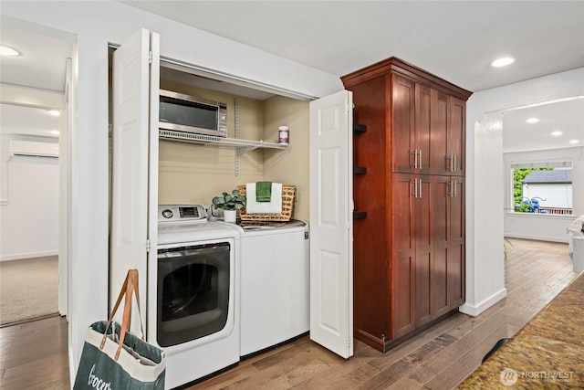 1339 N 167th St, Shoreline, WA 98133 - laundry room featuring washer and clothes dryer, a wall mounted AC, light wood-type flooring, and recessed lighting