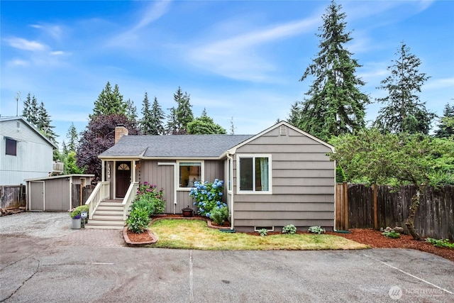 1339 N 167th St, Shoreline, WA 98133 - single story home with a chimney, a storage shed, and a shingled roof