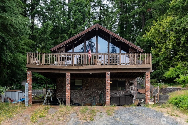 1927 SE Maple Dr, Chehalis, WA 98532 - back of property featuring a shed, a wooden deck, and brick siding