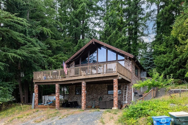 1927 SE Maple Dr, Chehalis, WA 98532 - back of property with a deck and brick siding