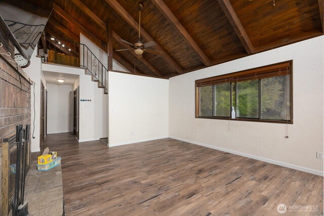 1927 SE Maple Dr, Chehalis, WA 98532 - unfurnished living room with a wooden ceiling with exposed beams, a ceiling fan, wood finished floors, a fireplace, and high vaulted ceiling