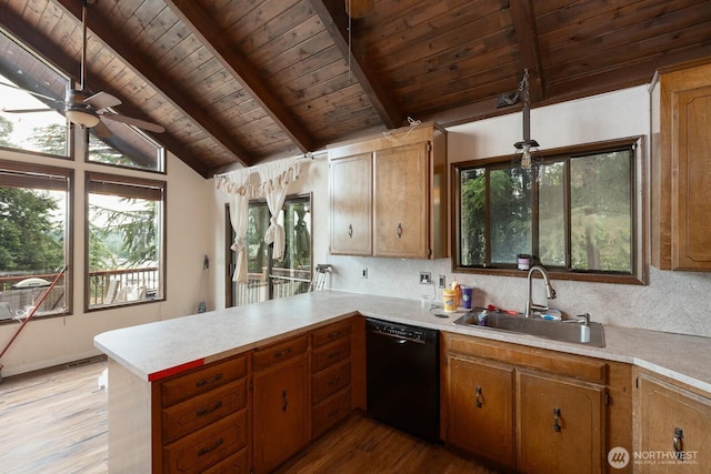 1927 SE Maple Dr, Chehalis, WA 98532 - kitchen featuring black dishwasher, wood ceiling, a peninsula, light countertops, and light wood-type flooring
