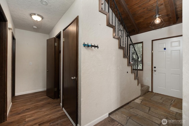 1927 SE Maple Dr, Chehalis, WA 98532 - foyer featuring stairway, beam ceiling, wood finished floors, and a textured ceiling