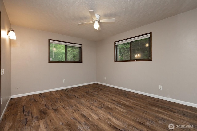 1927 SE Maple Dr, Chehalis, WA 98532 - unfurnished room featuring ceiling fan, plenty of natural light, and dark wood finished floors