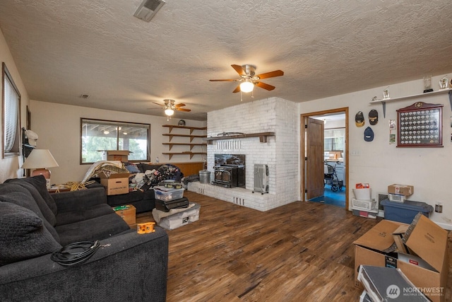1927 SE Maple Dr, Chehalis, WA 98532 - living area with wood finished floors, ceiling fan, and a textured ceiling