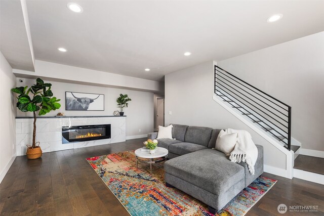 1422 Browns Point Blvd, Tacoma, WA 98422 - living room featuring wood-type flooring, a glass covered fireplace, recessed lighting, and stairs