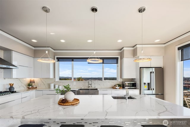 1422 Browns Point Blvd, Tacoma, WA 98422 - kitchen with appliances with stainless steel finishes, modern cabinets, white cabinets, recessed lighting, and ornamental molding