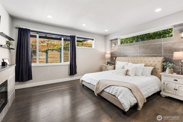 1422 Browns Point Blvd, Tacoma, WA 98422 - bedroom featuring dark wood-style flooring, recessed lighting, and a tile fireplace