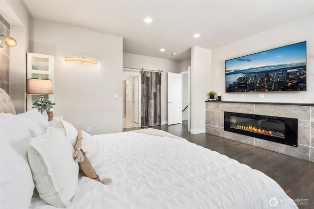 1422 Browns Point Blvd, Tacoma, WA 98422 - bedroom with a tile fireplace, wood finished floors, and recessed lighting