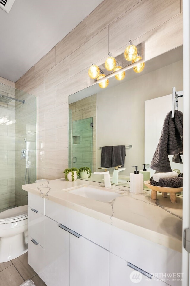 1422 Browns Point Blvd, Tacoma, WA 98422 - full bathroom featuring vanity, a tile shower, and tile walls