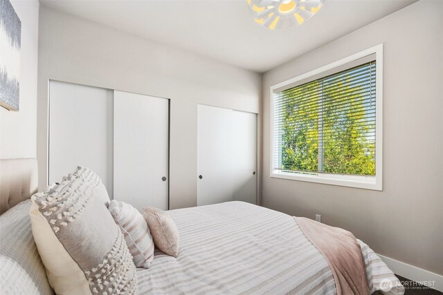 1422 Browns Point Blvd, Tacoma, WA 98422 - bedroom featuring baseboards and two closets
