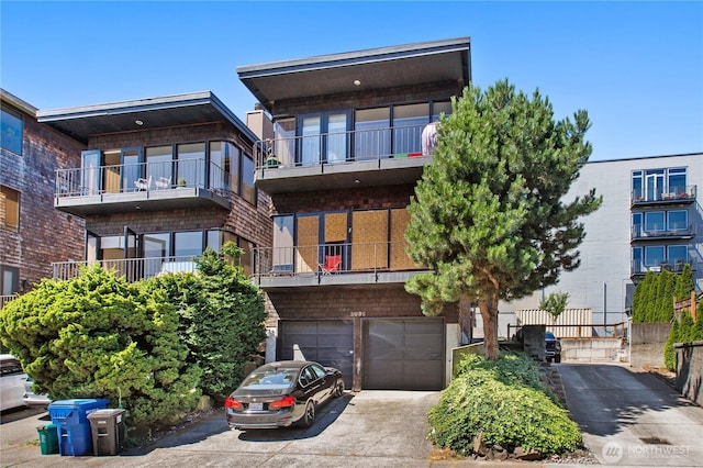 2035 Waverly Pl N, Seattle, WA 98109 - view of front of property featuring driveway, a garage, and brick siding