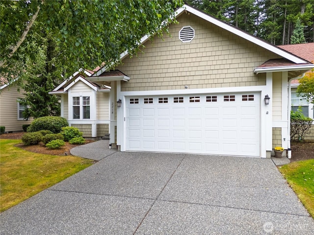 2218 Cascade Ct, Anacortes, WA 98221 - view of front of house with concrete driveway and a garage