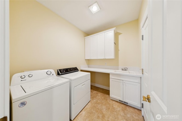 2218 Cascade Ct, Anacortes, WA 98221 - laundry area featuring washing machine and dryer, cabinet space, and light tile patterned flooring