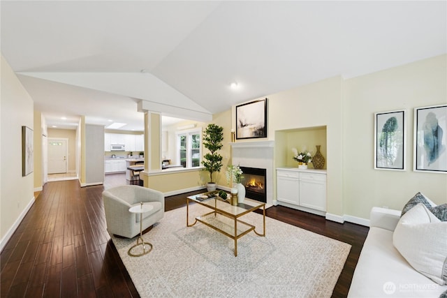 2218 Cascade Ct, Anacortes, WA 98221 - living room with a glass covered fireplace, dark wood finished floors, lofted ceiling, and recessed lighting