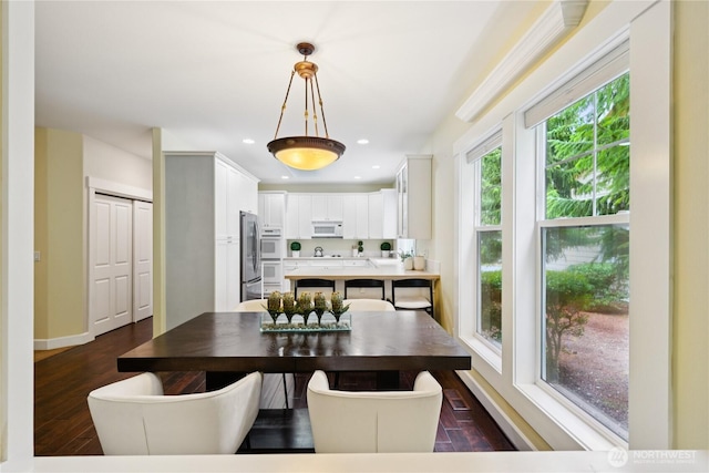 2218 Cascade Ct, Anacortes, WA 98221 - dining area featuring dark wood-type flooring and recessed lighting
