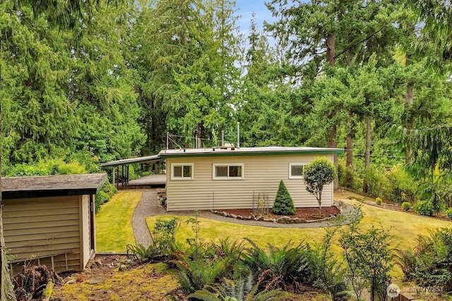 4210 Lakeway Dr, Bellingham, WA 98229 - view of front facade featuring a front lawn, a carport, and a shed