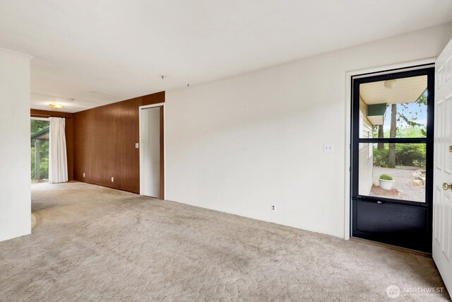 4210 Lakeway Dr, Bellingham, WA 98229 - empty room featuring carpet flooring and wood walls