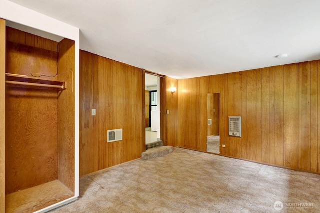 4210 Lakeway Dr, Bellingham, WA 98229 - empty room with wooden walls and carpet