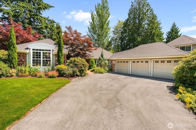 2444 220th Pl NE, Sammamish, WA 98074 - ranch-style home with an attached garage, asphalt driveway, a front lawn, and brick siding