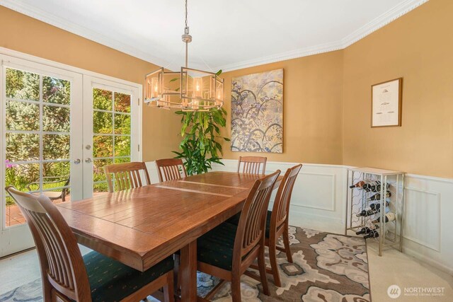 2444 220th Pl NE, Sammamish, WA 98074 - dining space with a decorative wall, french doors, a chandelier, ornamental molding, and carpet floors