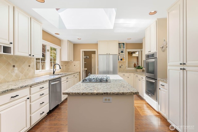 2444 220th Pl NE, Sammamish, WA 98074 - kitchen featuring appliances with stainless steel finishes, a center island, dark wood-style floors, backsplash, and recessed lighting