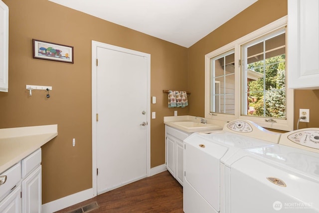 2444 220th Pl NE, Sammamish, WA 98074 - laundry area featuring cabinet space, separate washer and dryer, and dark wood finished floors
