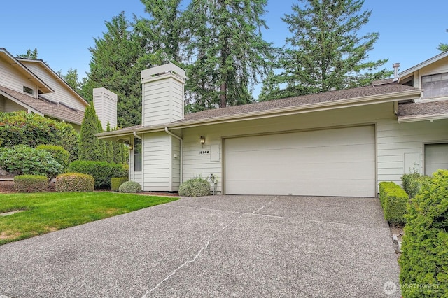 16142 SE 33rd Ln, Unit Bellevue, WA 98008 - view of front of home featuring a garage, driveway, and a chimney