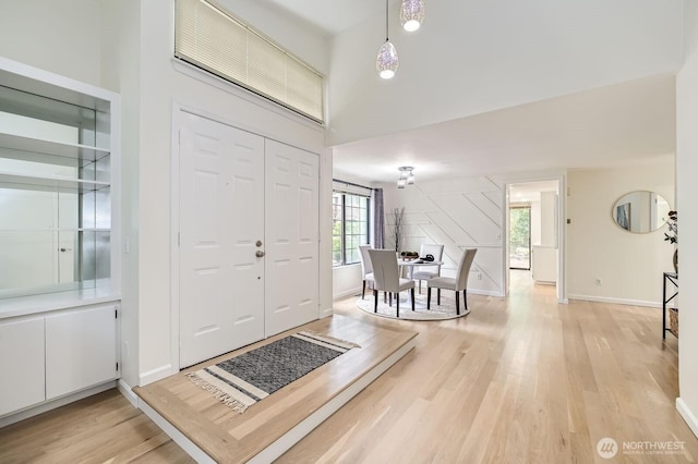16142 SE 33rd Ln, Unit Bellevue, WA 98008 - entryway with light wood-type flooring and a towering ceiling
