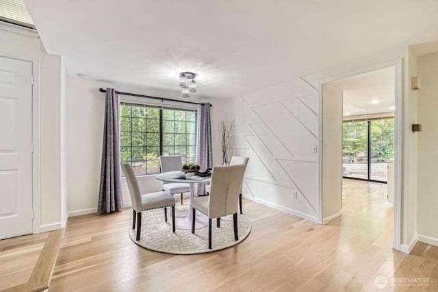 16142 SE 33rd Ln, Unit Bellevue, WA 98008 - dining space with plenty of natural light, light wood-style floors, and a chandelier