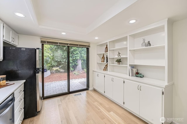 16142 SE 33rd Ln, Unit Bellevue, WA 98008 - kitchen with freestanding refrigerator, stainless steel dishwasher, recessed lighting, light countertops, and light wood finished floors